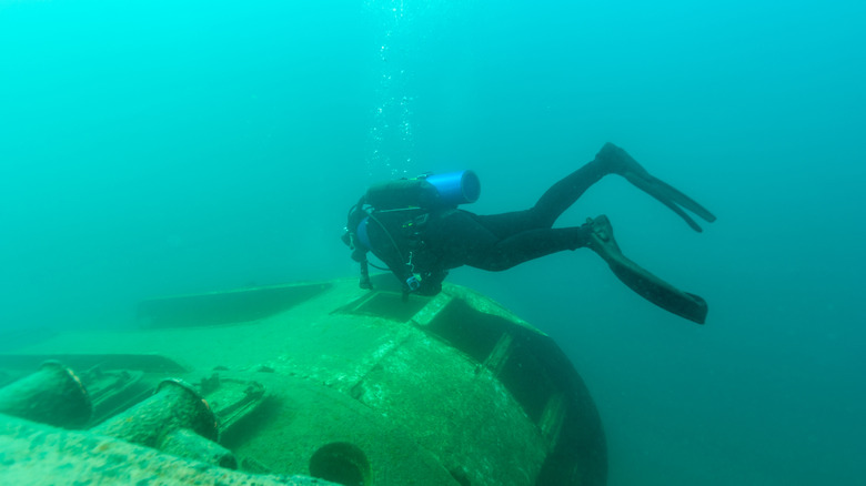 An underwater diver checks out a shipwreck in Lake Michigan