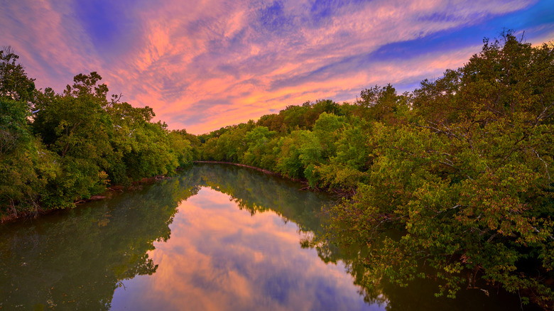 Purple and orange clouds over Ohio river