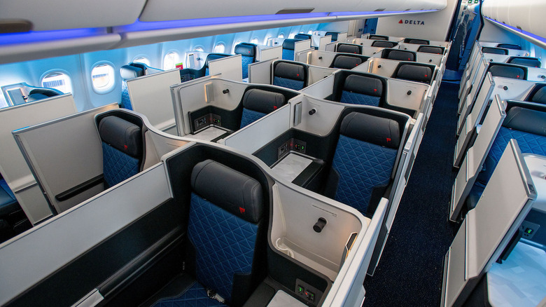 the private Delta One suites feature doors that can be closed for privacy and lie-flat seats