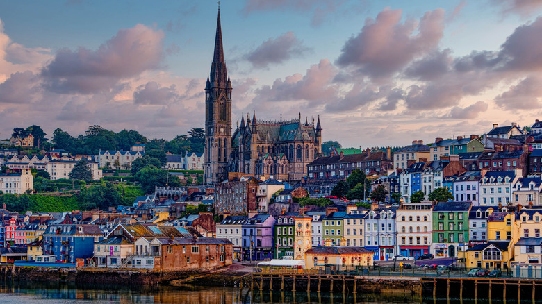 The harbor at Cobh, Ireland, featuring colorful buildings and a tall church