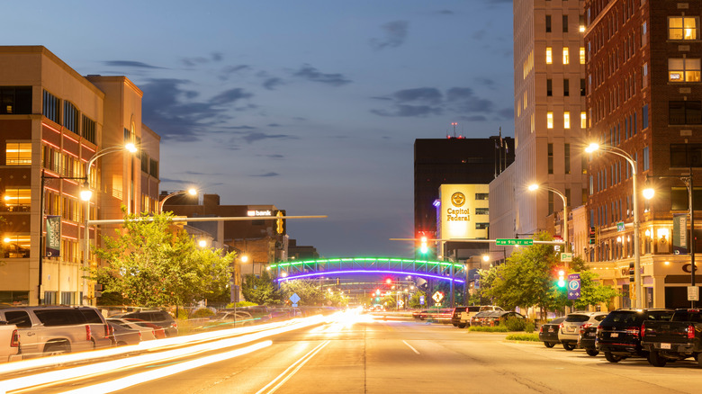 Evening traffic streams down Kansas Ave in the heart of historic downtown Topeka