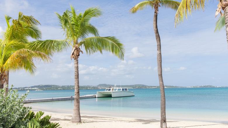 Image of the beach and dock at Jumby Bay Island