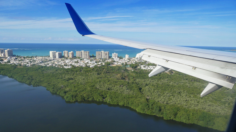 View from airplane flying above Puerto Rico on sunny day