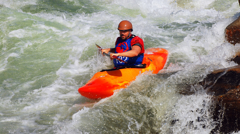 Kayak on whitewater river run, Bailey Canyon, CO