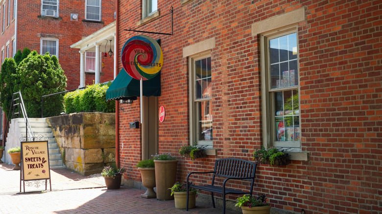 A red-brick building with a bench