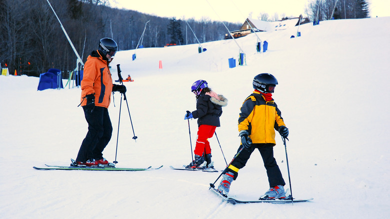 A family skiing in Ludlow, Vermont