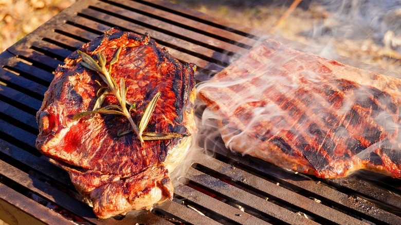 Grilling steak outside on a BBQ