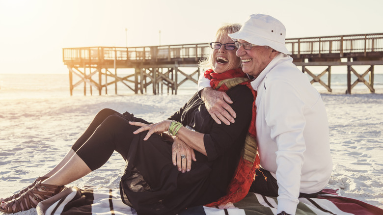 An older couple enjoying time together on a beach
