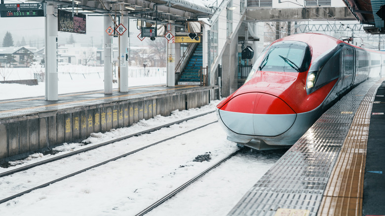 The Akita Shinkansen bullet train arriving at Tazawako Staiton in Japan