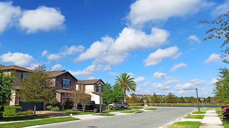 A residential street in Casselberry, Florida, with houses and trees