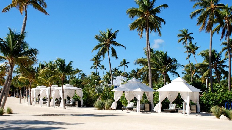A view of the white bungalows on the beach at the Islander Resort