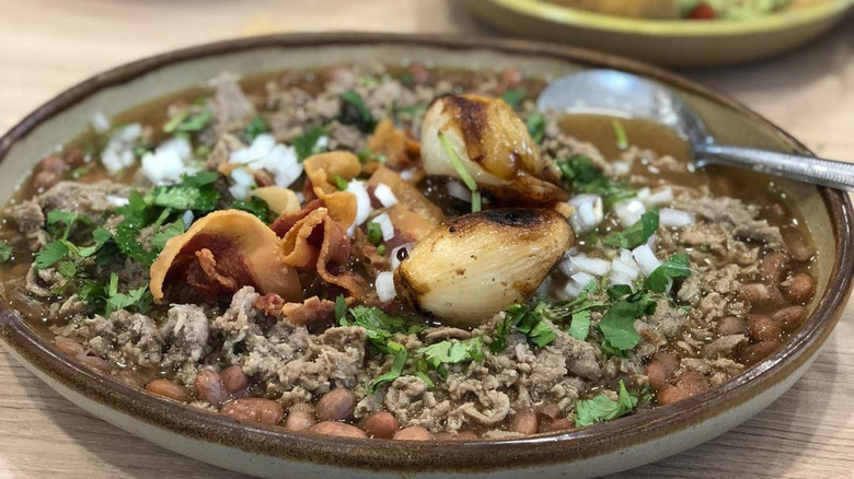 Close-up image of carne en su jugo (meat in its juices), the main dish at the fast-food chain Karne Garibaldi in Guadalajara, Mexico