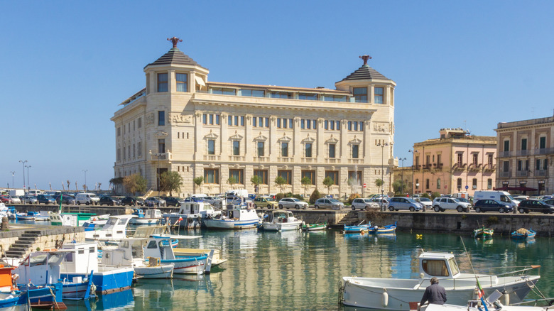 Fishing boats in the water in front of the Ortea Palace Hotel