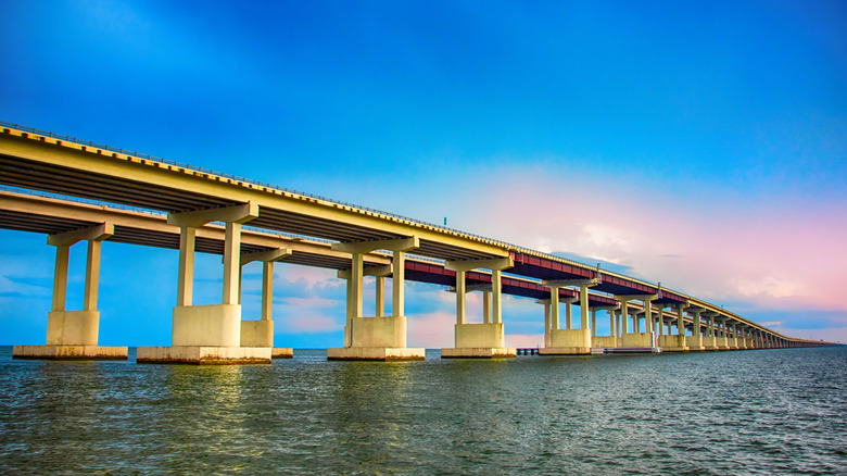Blue and pink sky behind Interstate 10 as it crosses over Lake Pontchartrain in Louisiana