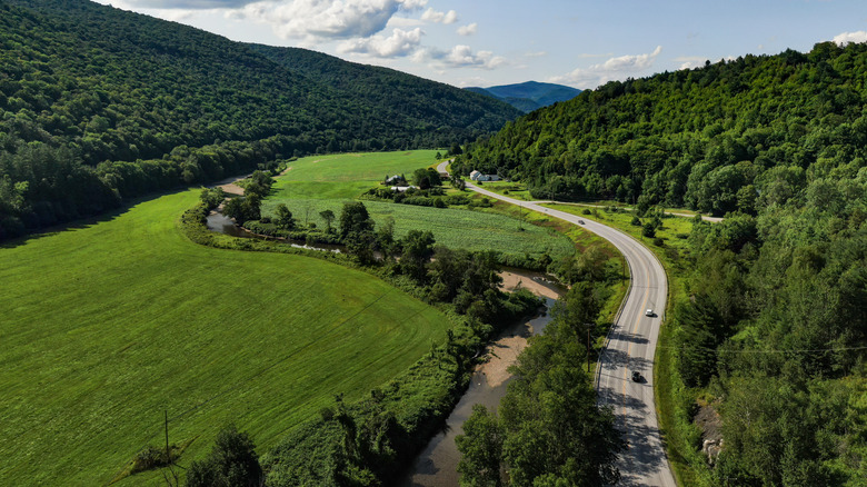 Route 100 surrounded by hills and trees
