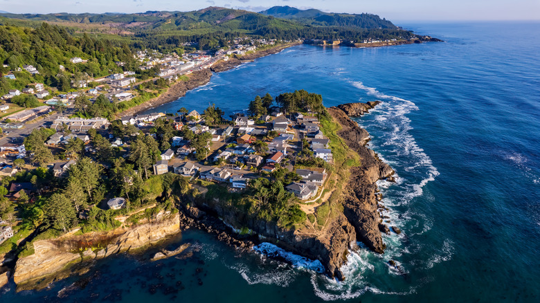 Aerial view of Depoe Bay houses perched on cliffs overlooking Pacific Ocean