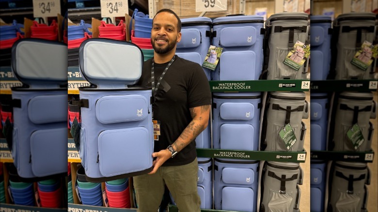 Shopper holding up a Sam's Club cooler in-store