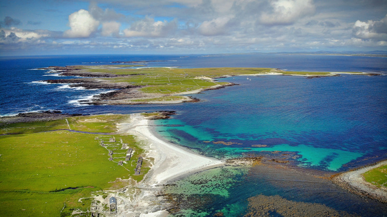 An aerial view of the Inishkea Islands and turquoise water on a sunny day