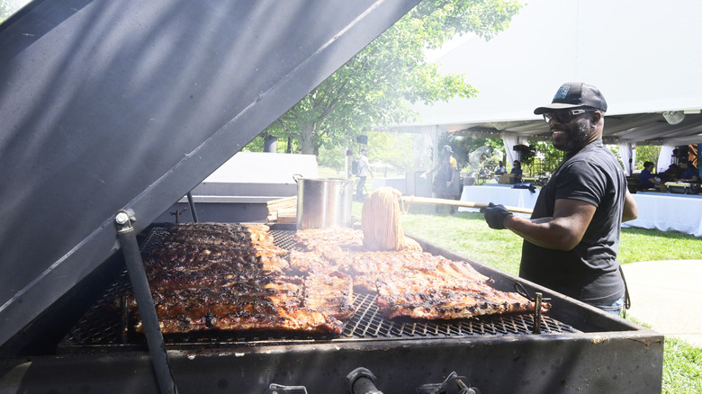 Pitmaster Rodney Scott behind a barbecue