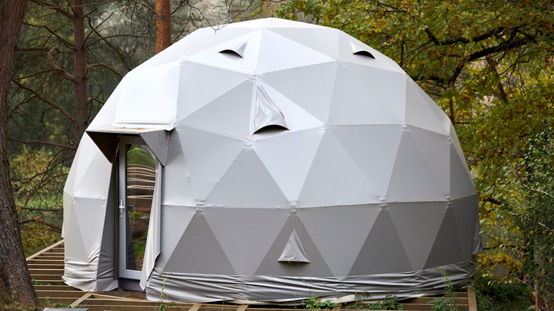 A geodome glamping structure in the woods