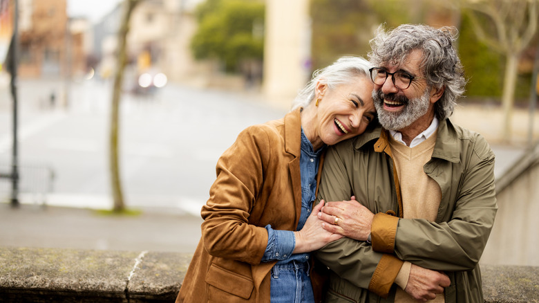 A happy gray-haired couple enjoying the outdoors
