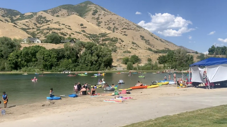 Families and children play in the water near Wayne Bartholomew Family Park