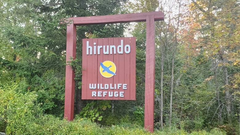 A sign welcomes visitors to Hirundo Wildlife Refuge