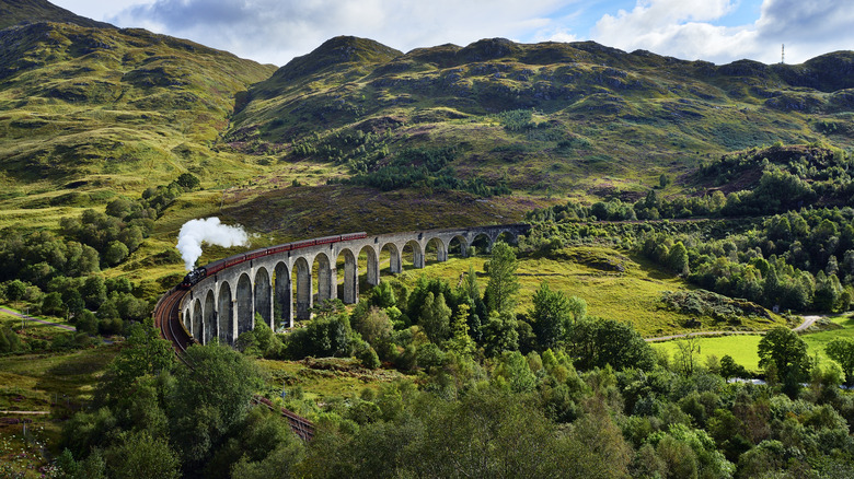 Glenfinnan Viaduct traveling through mountains