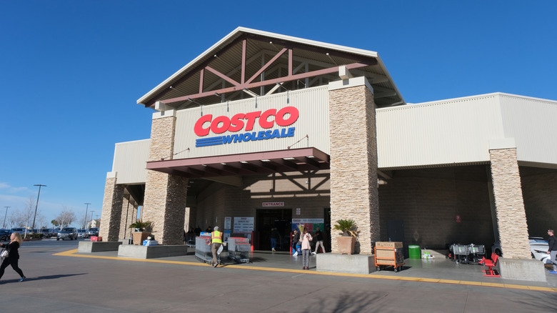 Customers can be seen coming and going in front of a Costco Wholesale warehouse