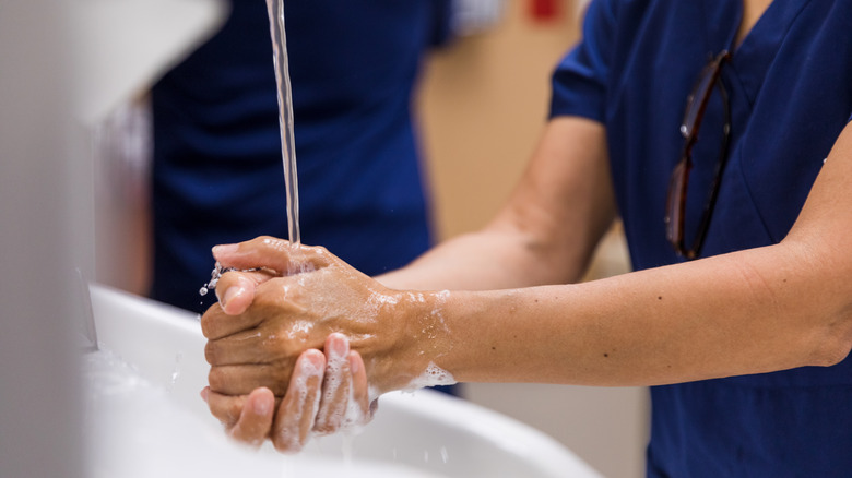 A woman washing hands