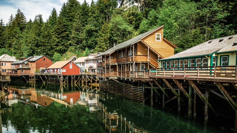 Houses and buildings over water on stilts down Creek Street in Ketchikan, Alaska.