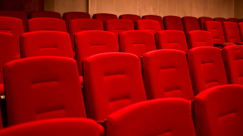 Close up of red theater chairs in rows