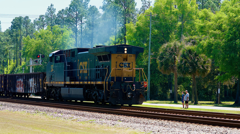 lkston, Georgia, USA - April 5, 2021: A CSX freight locomotive travels through the "Folkston Funnel" in southeast Georgia near the Florida state line.