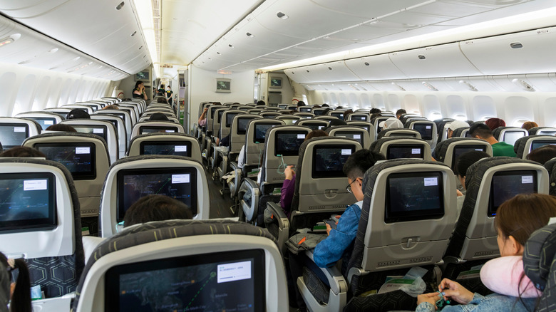 Passengers sitting in EVA Air cabin