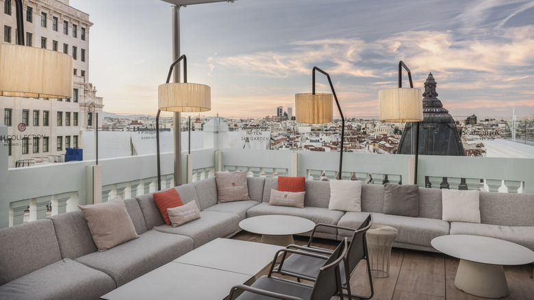 Couches on the rooftop of NH Collection Gran Via's Picalagartos Bar