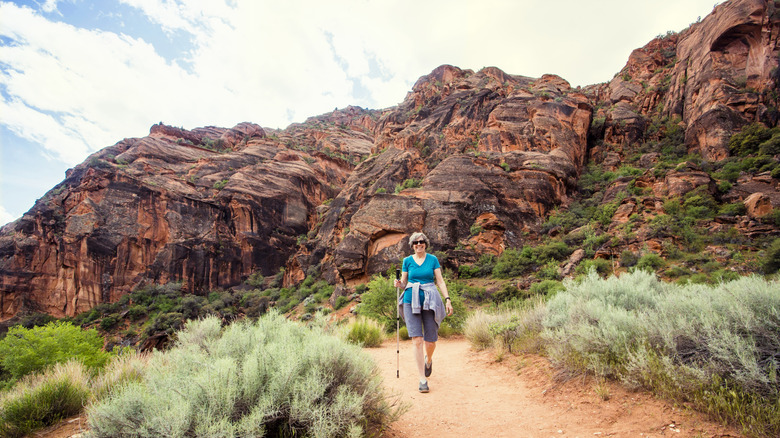 Happy senior woman hiking in Utah