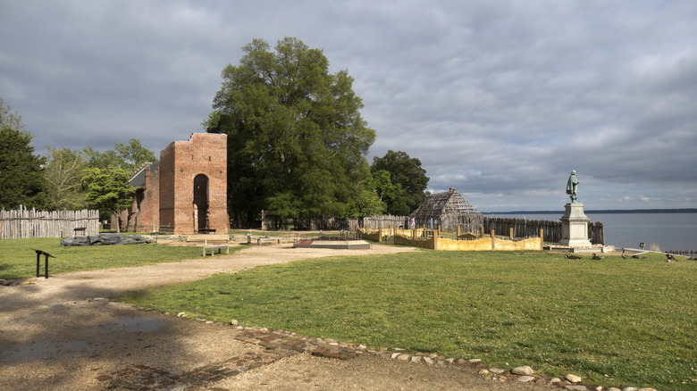 Historic Jamestowne ruins with statue of John Smith looking out at the water