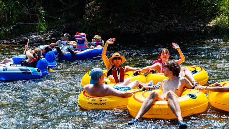 People float in tubes on Clear Creek, Colorado.
