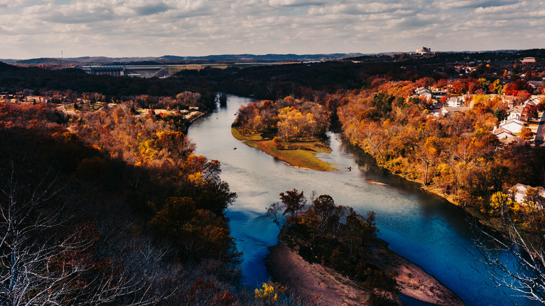 Scenic overlook outside Branson, Missouri, with a river surrounded by trees in fall foliage
