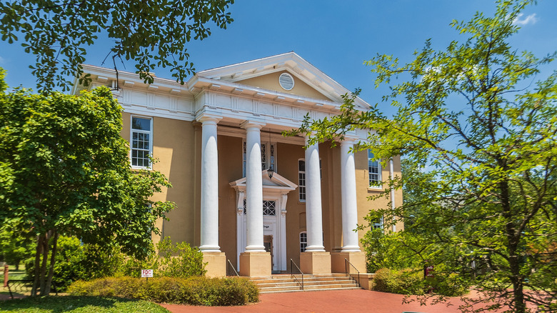 A brick building with columns on the campus of the University of South Carolina