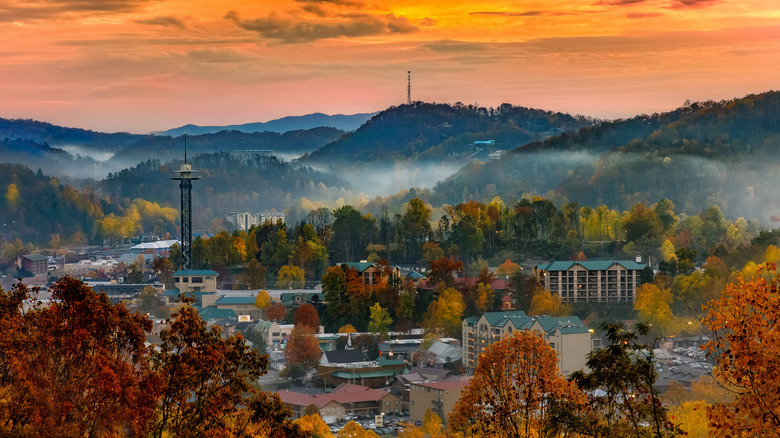 Gatlinburg city skyline in the fall, with misty mountains and colorful foliage