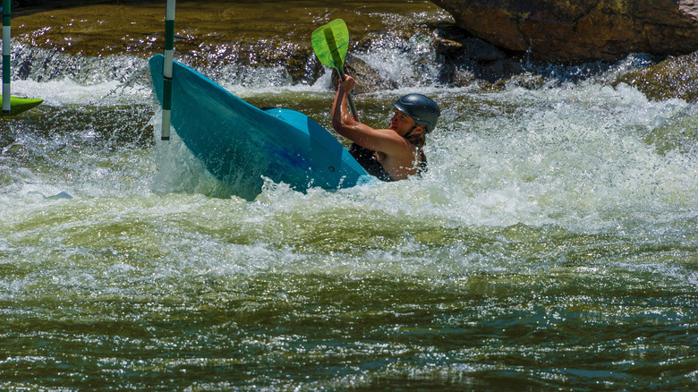 A kayaker navigates a water obstacle course in Bryson City, North Carolina