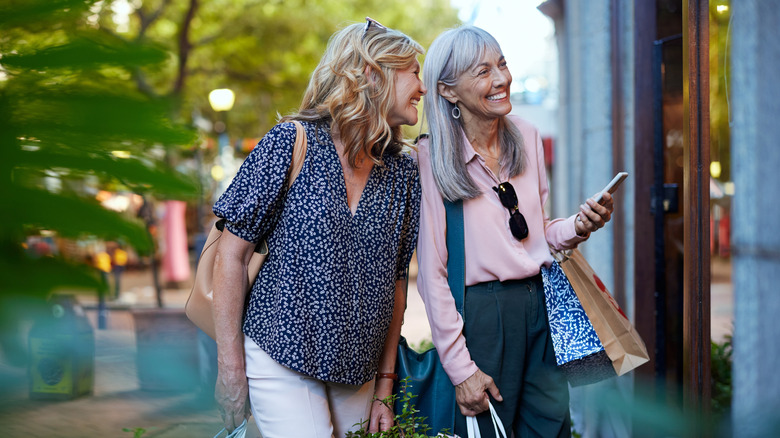 Two women shopping and laughing