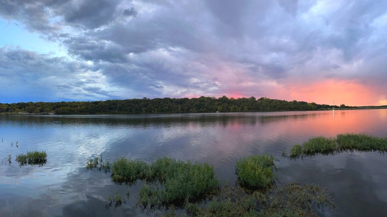 Scenic view of sunset and storm clouds over Lake Olathe, Kansas