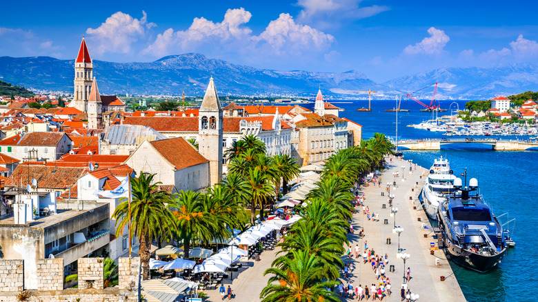 Sunny promenade along the pier of  Trogir, Croatia.