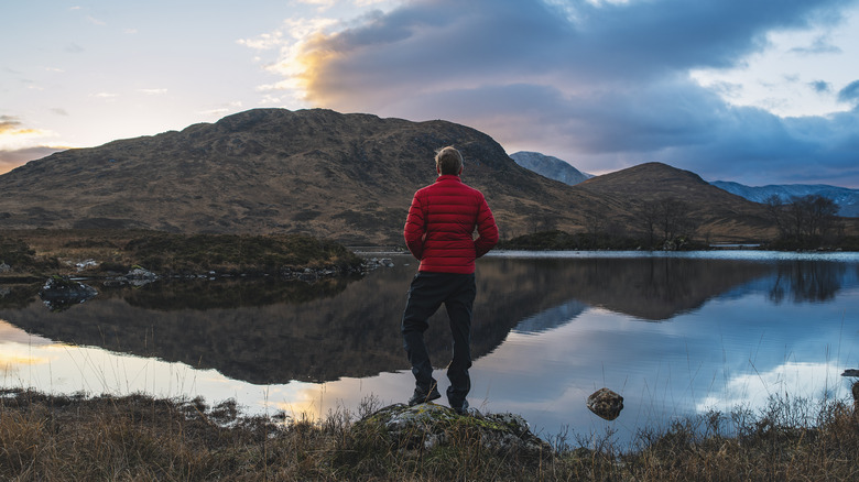 Hiker looking out at mountains in the distance
