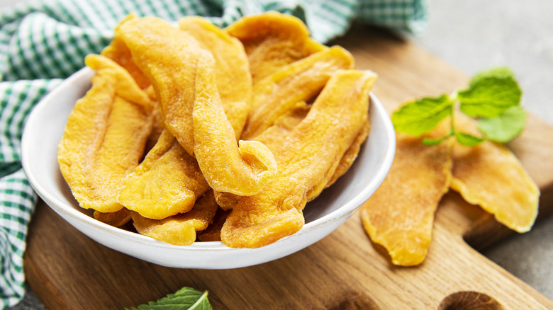 A bowl of sliced, dried mango