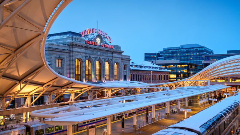 Denver Union Station glowing in blue evening light