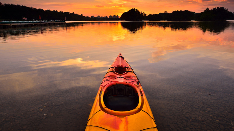 A kayak on n Lake Flower, Saranc Lake, at sunset