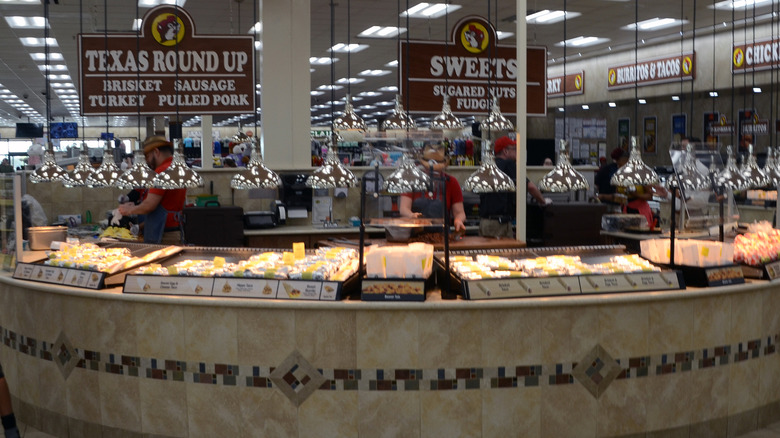Employees working the food counters at Buc-ee's